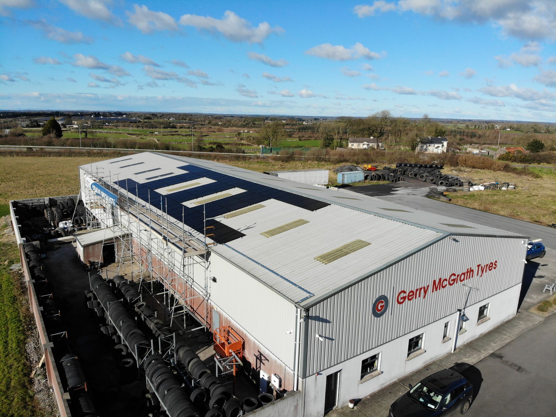 Rooftop commercial solar panels aerial view