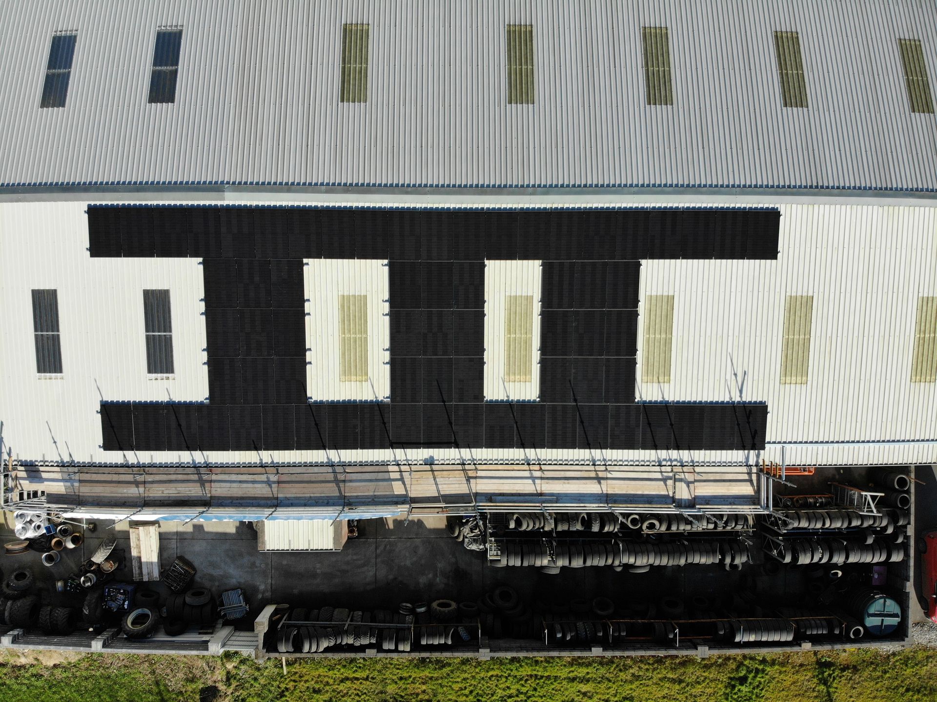 Rooftop commercial solar panels drone view