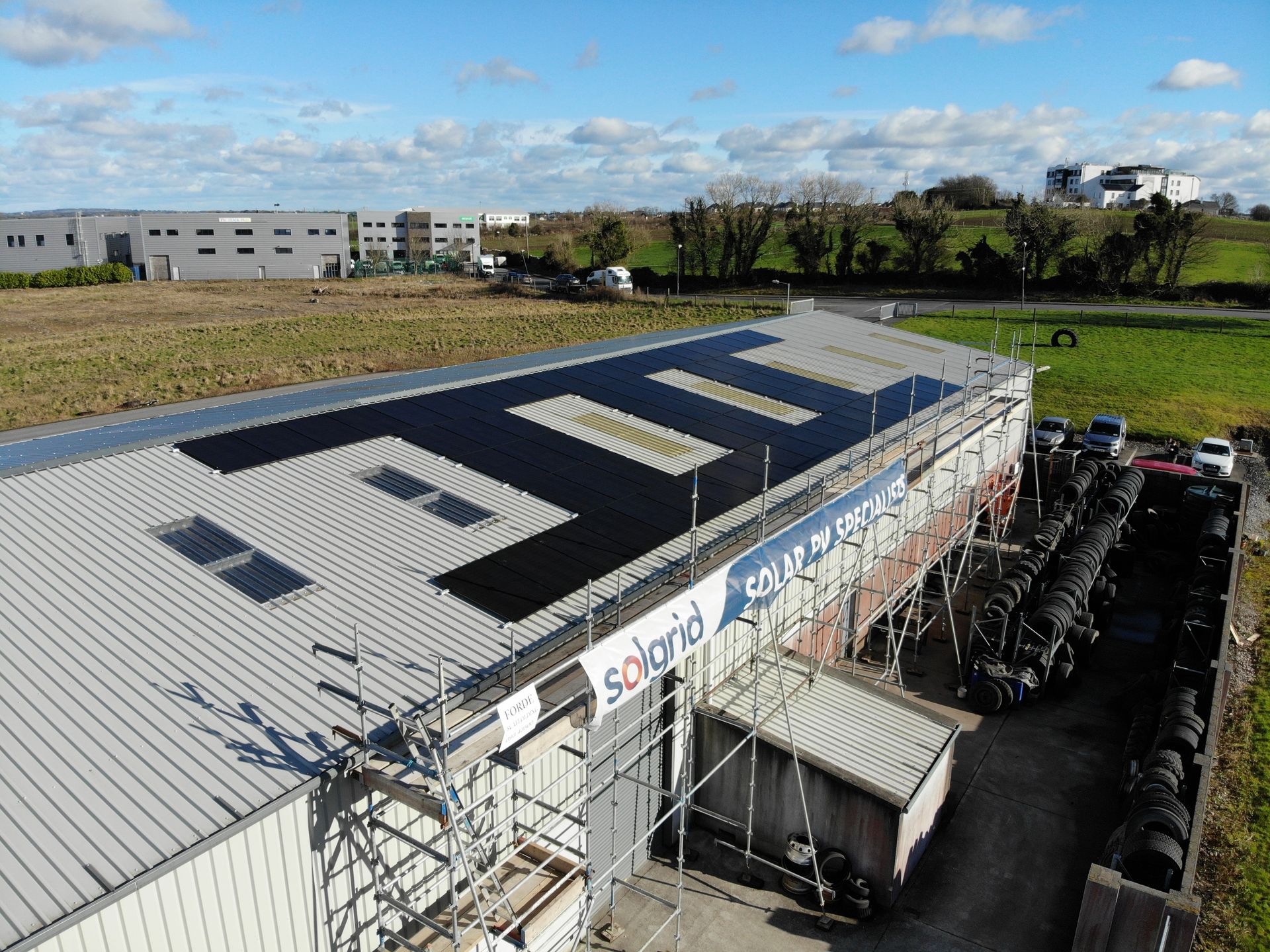 Rooftop commercial solar panels aerial view