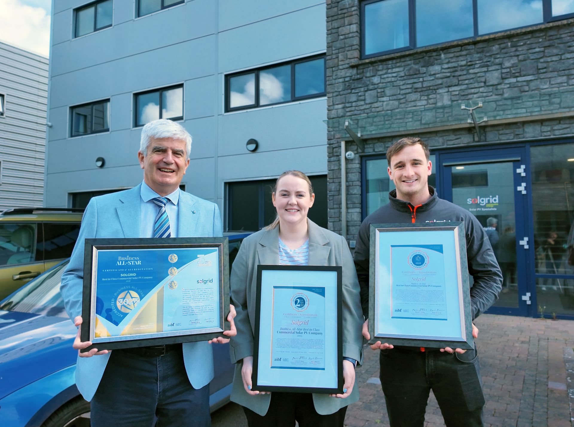 Aidan McCurtin, Vicky Dervan and Charles Nevin with accreditations for 2024,2025 and 2026