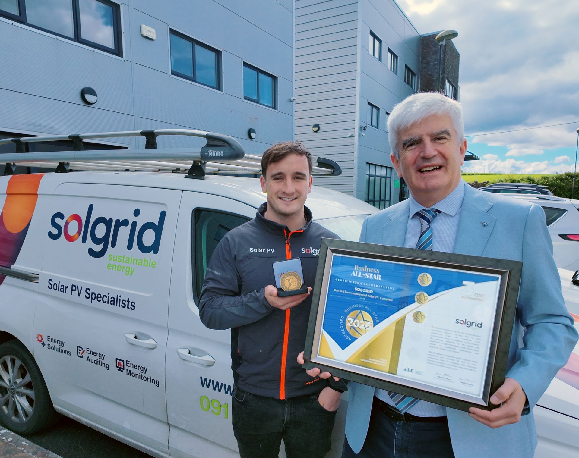 Charles Nevin and Aidan McCurtin accept Business All-Star 3rd year accreditation